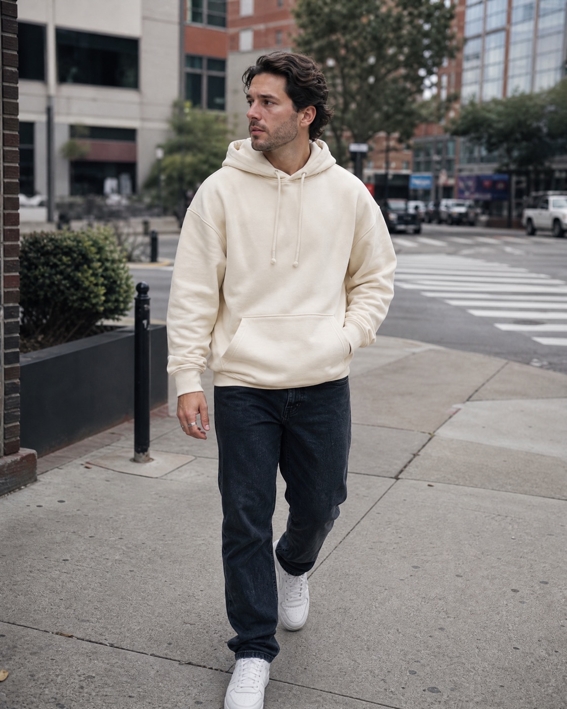 AI-generated street style UGC photo of a man wearing a cream hoodie